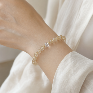 Golden Radiance | 6 mm Rutilated Quartz Bracelet - Gold rutilated quartz, clear quartz, gold-finished silver bracelet product photograph